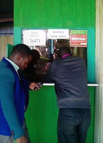 M-PESA agent with people queuing outside M-PESA agent with people queuing outside