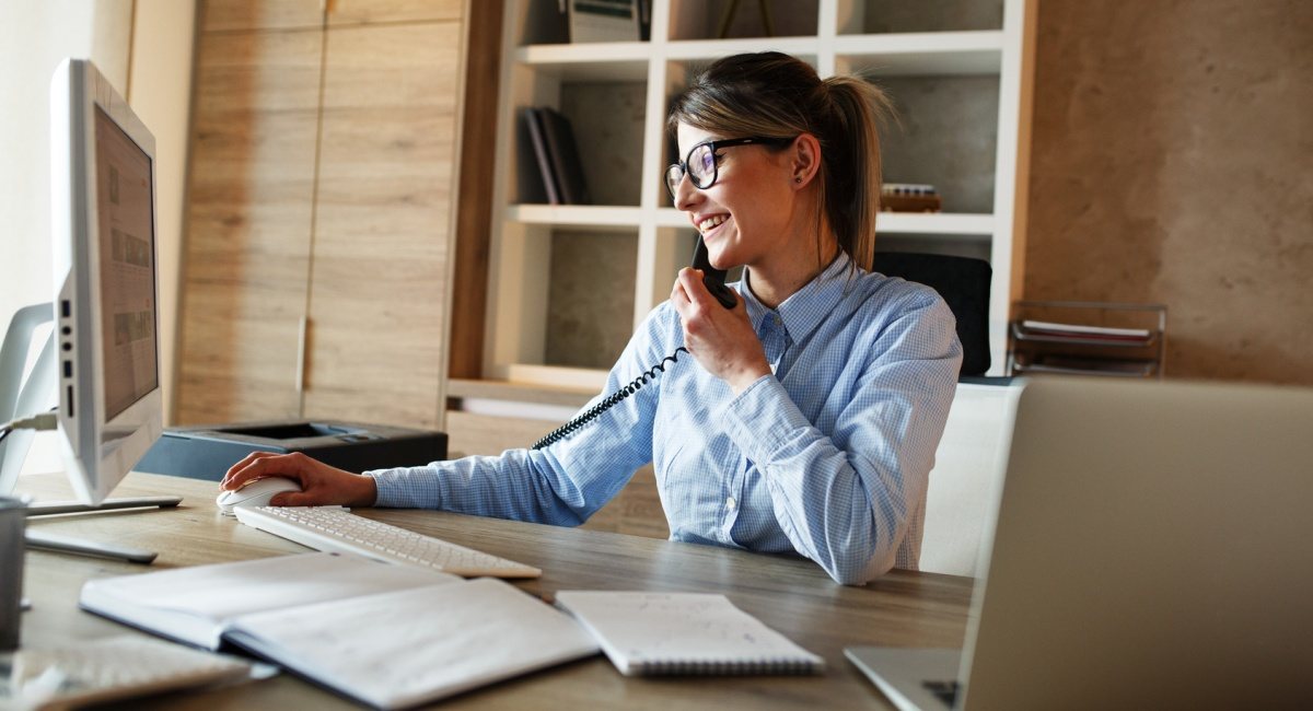 woman taking phone payment