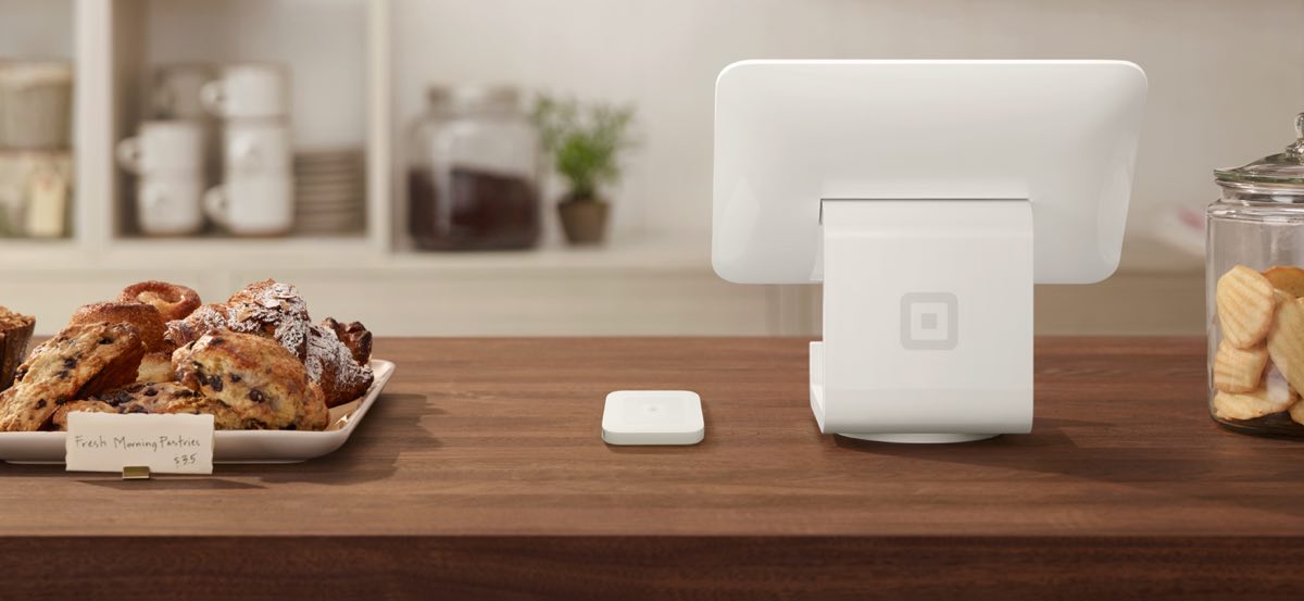Square Stand on a counter in a coffee shop Square Stand and contactless reader in coffee shop