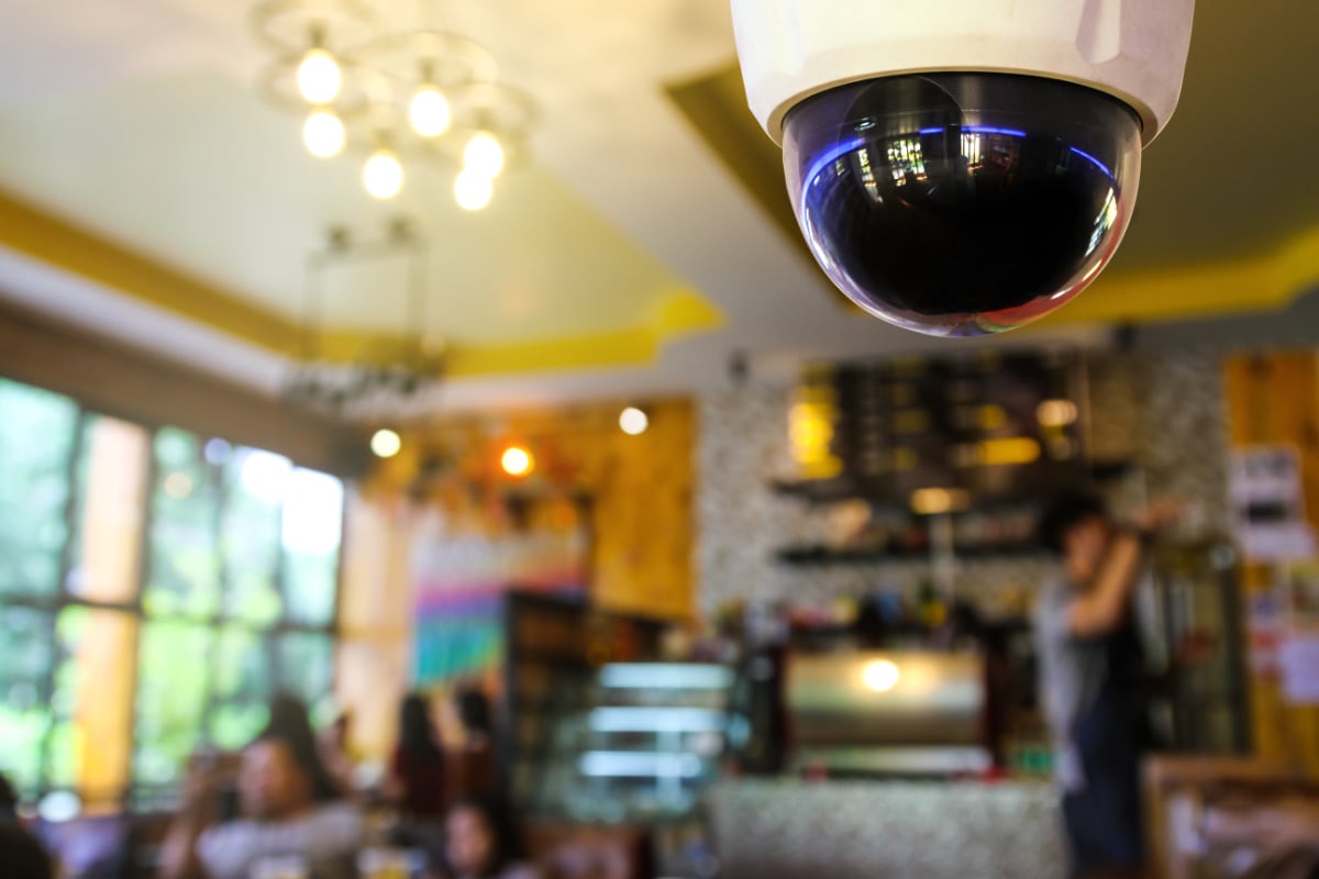 CCTV camera in the ceiling of a cafe
