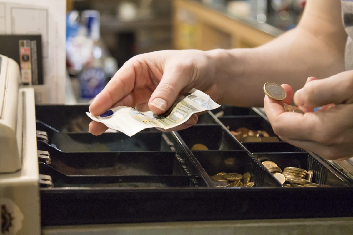 Collecting change from cash drawer cash drawer handling money