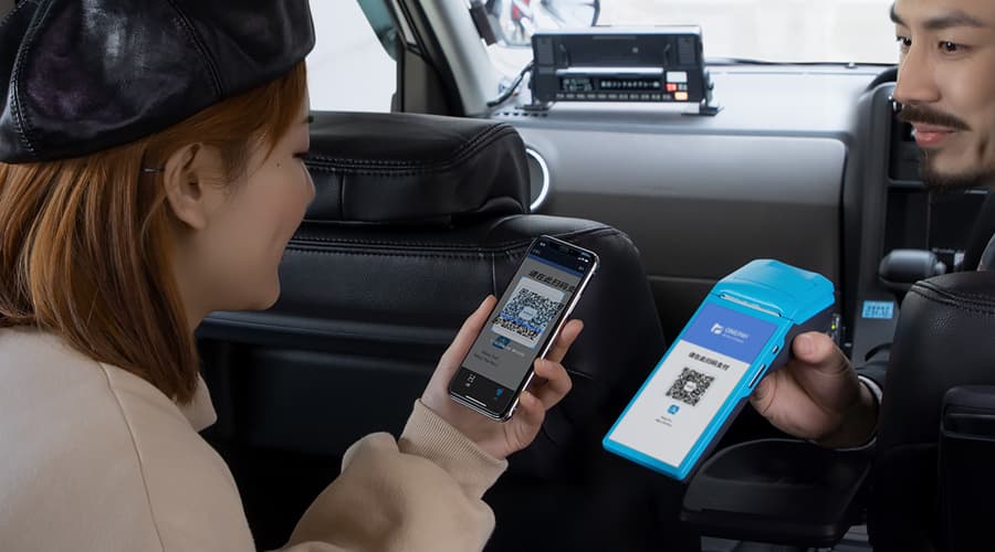 Alipay QR code payment in a taxi in China Alipay QR code payment in taxi in China