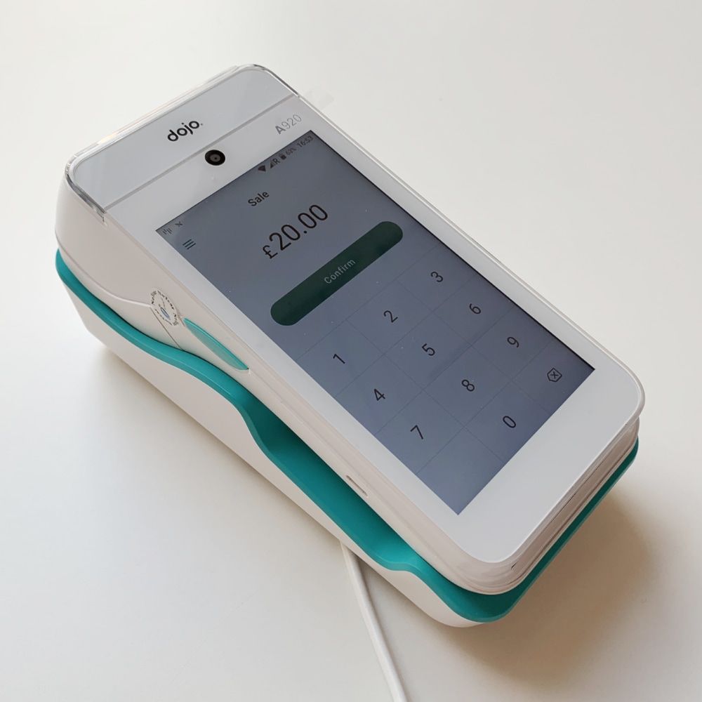 Dojo Go in charging cradle Dojo Go in battery charging dock