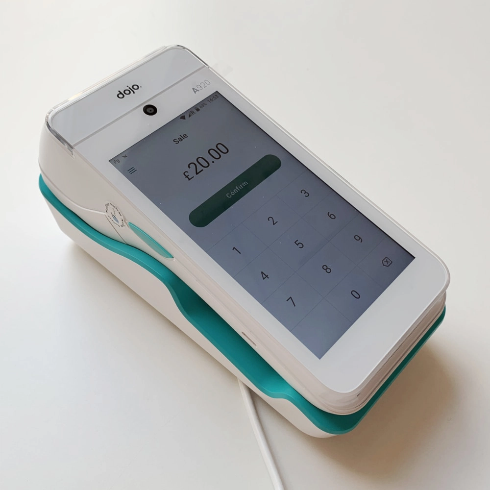Dojo Go in charging cradle Dojo Go in battery charging dock
