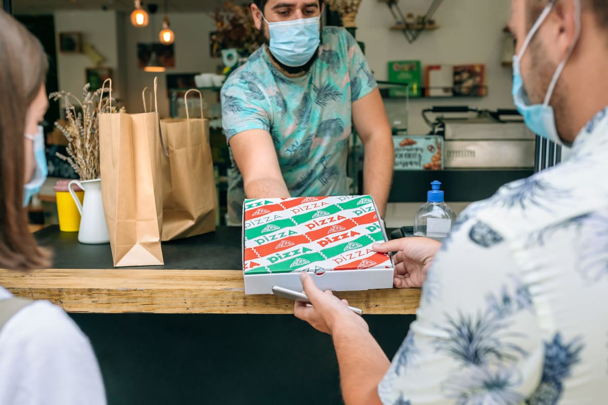 Order-to-collect in small food business pizza order collected at counter