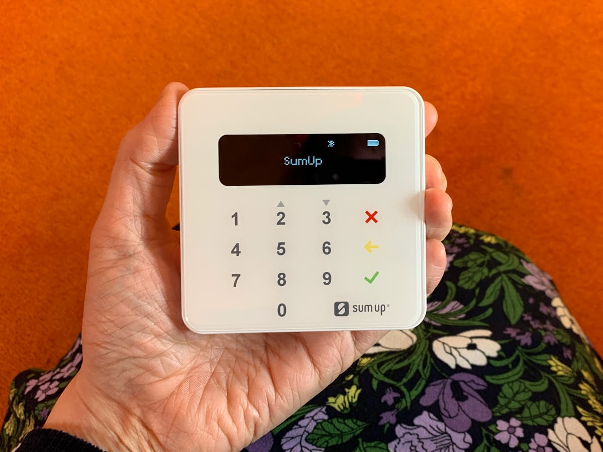 SumUp Plus is wireless and fits well in the hand SumUp Plus card reader in hand