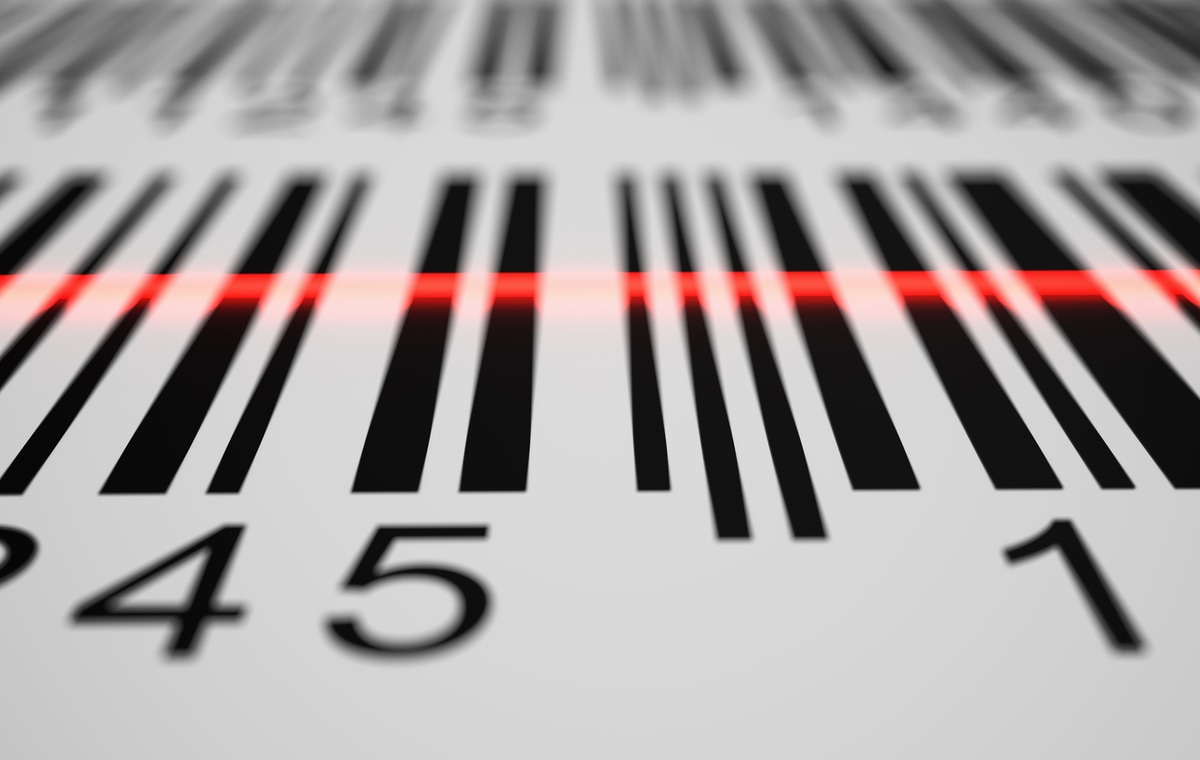 A barcode scanner uses light to read the black and white pattern of codes scanner laser on barcode stripes