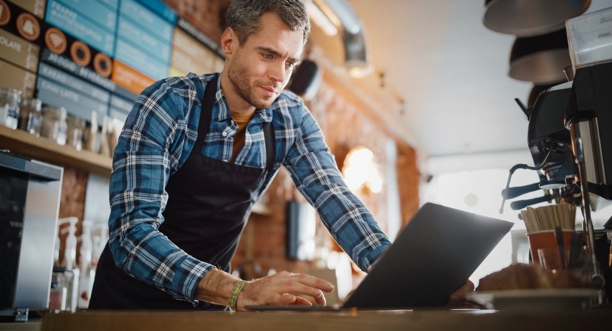 cafe owner using laptop