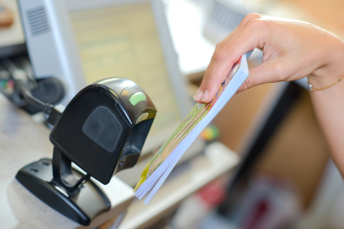 Presentation barcode scanner at a retail checkout stationary barcode scanner being presented with a barcode