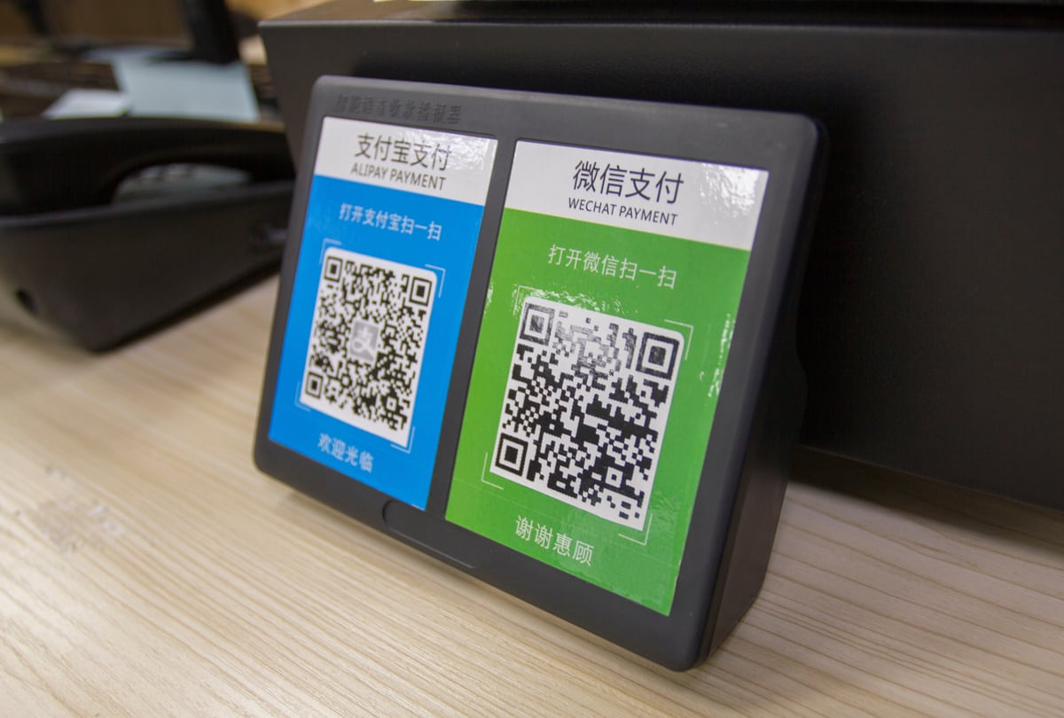 Merchants can display Alipay and WeChat Pay QR codes by the till Alipay and WeChat Pay QR codes