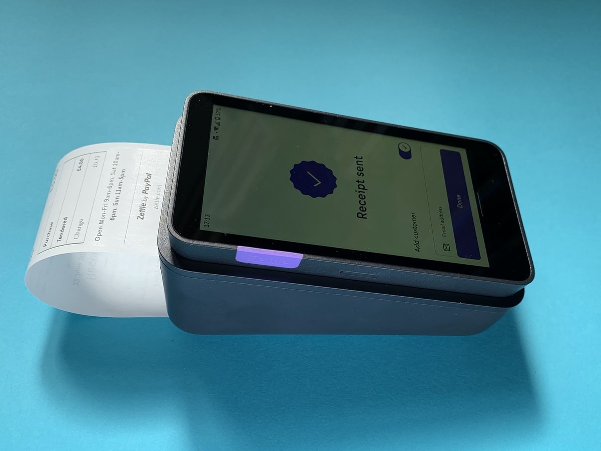 Zettle Terminal is handy for on-the-go printing Zettle Terminal with a printed receipt hanging out of the dock