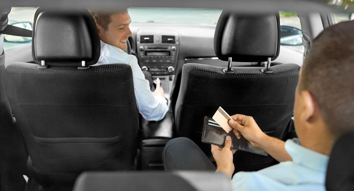 Taxi driver accepting card payment