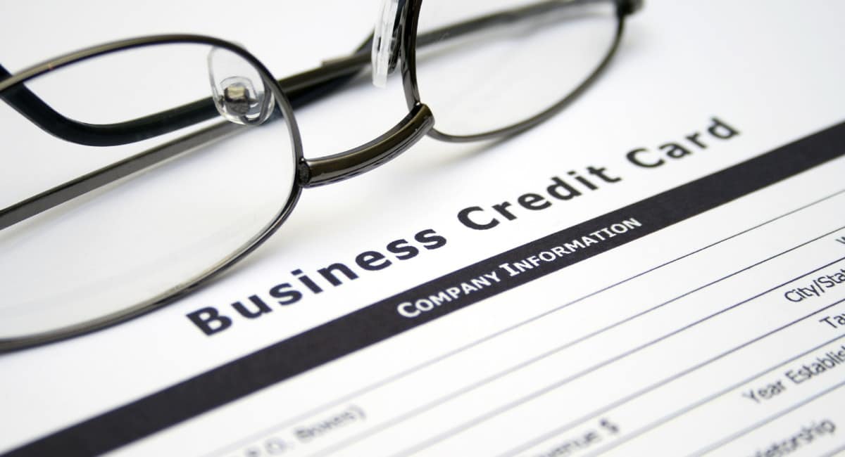 business credit card application and glasses