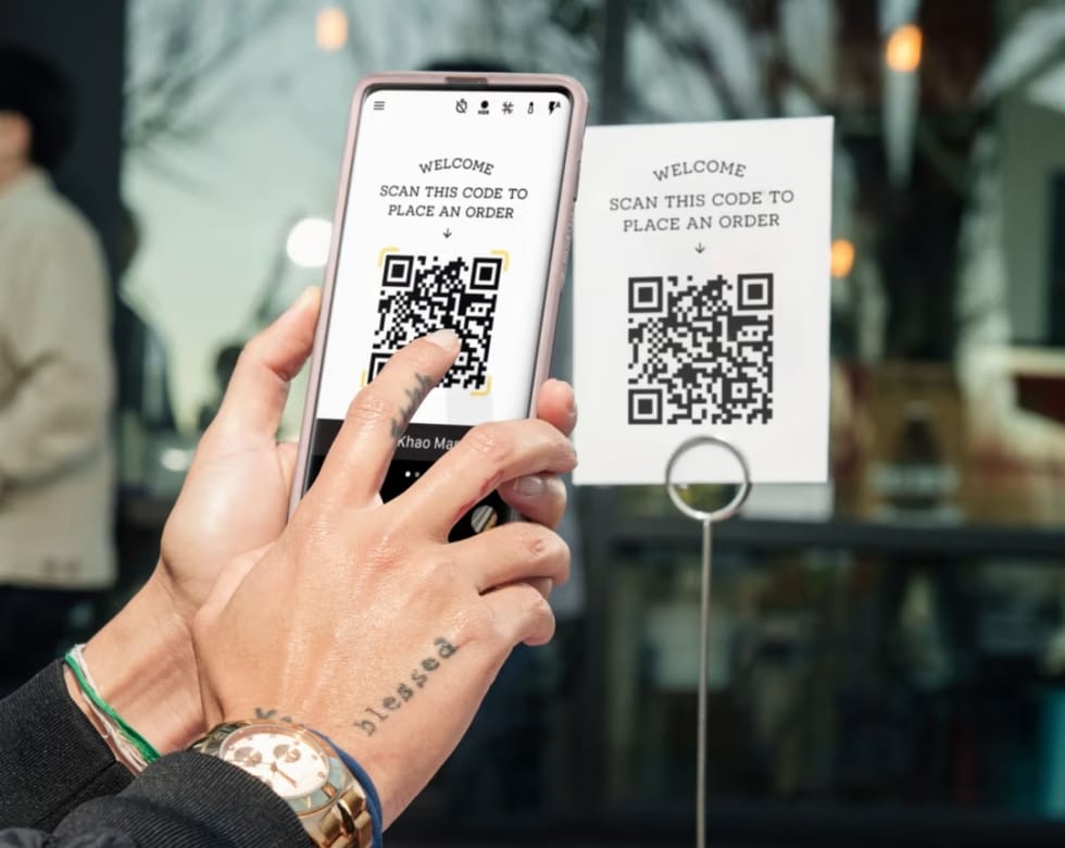 Square QR code ordering is free to implement Square QR code being scanned by hands and phone