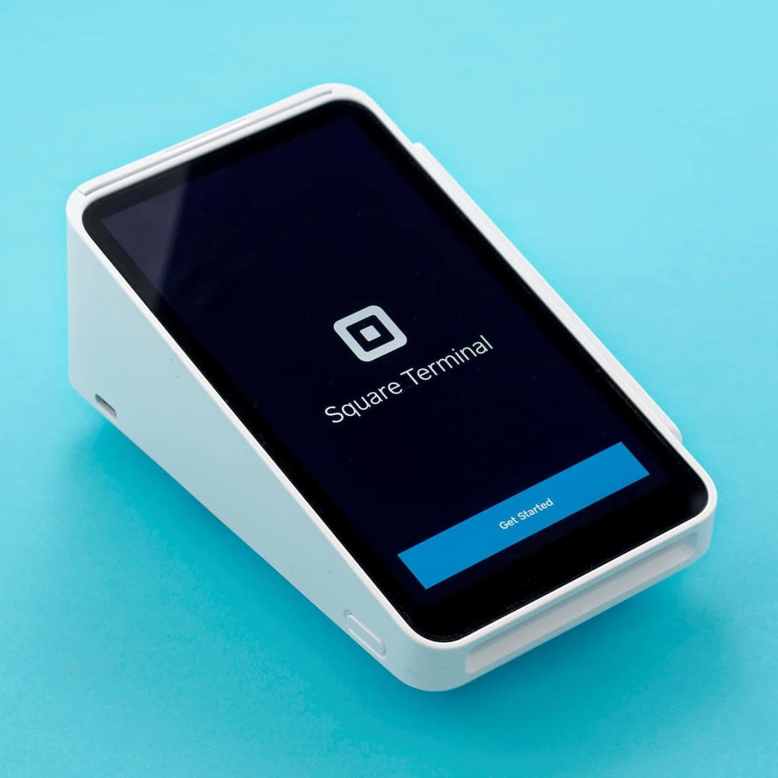 Square Terminal is a touchscreen ETPOS terminal for the countertop Square Terminal on blue background