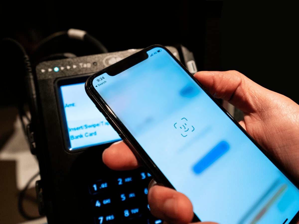 Newer iPhones use Face ID to verify Apple Pay transactions iPhone Face ID above card terminal