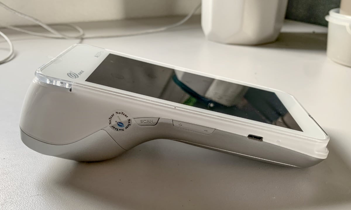 Smartpay Touch is a PAX A920 card terminal PAX A920 card machine on a table surface