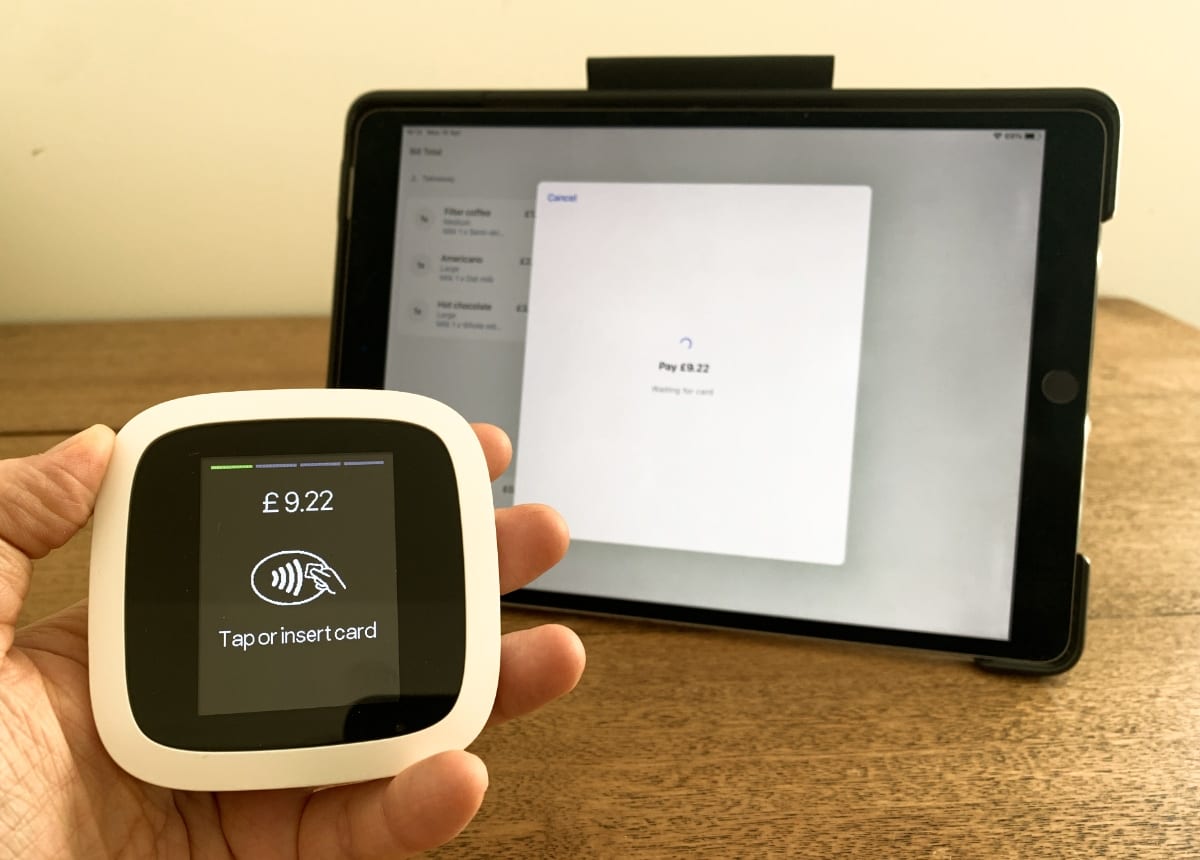 Revolut Reader is the only card reader connecting with Revolut POS Revolut Reader being held up in front of Revolut POS, ready for a card transaction