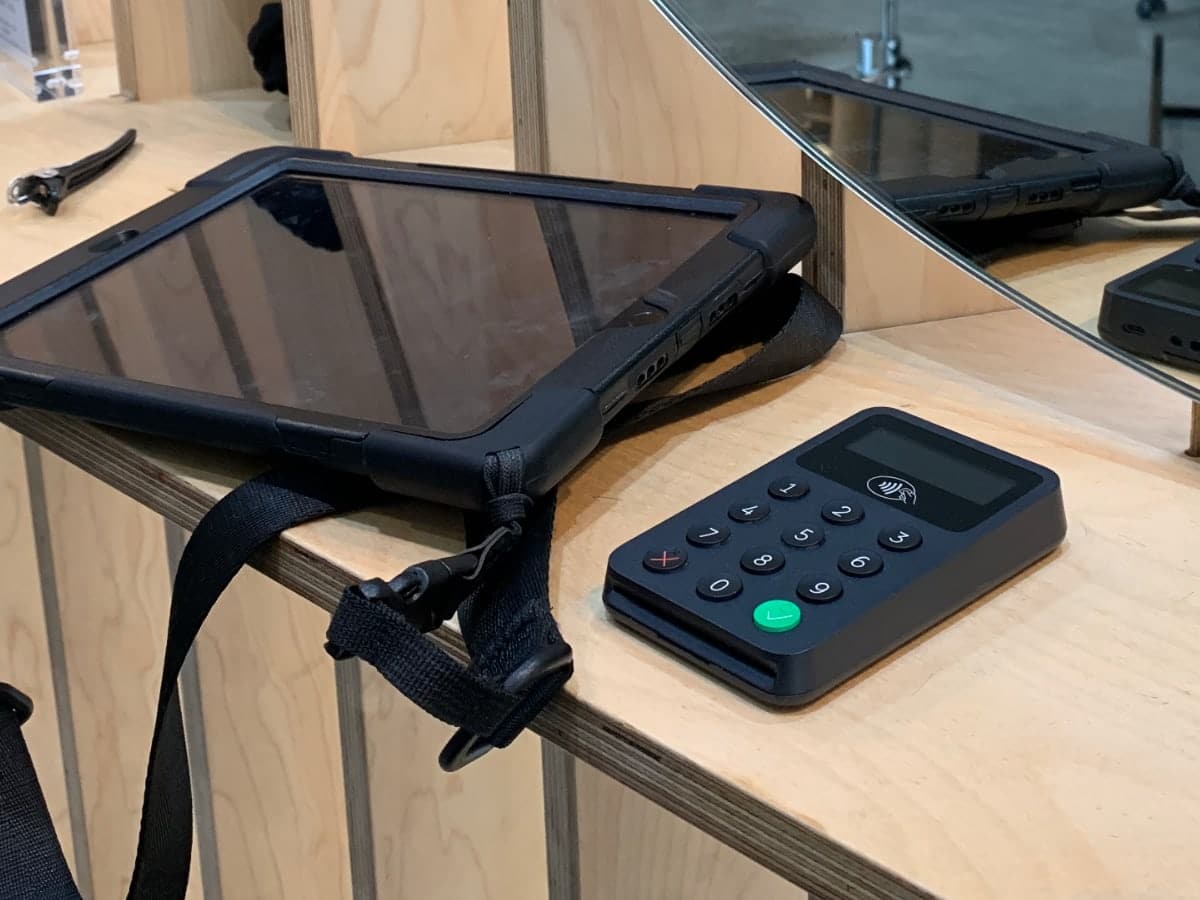 Zettle Reader by PayPal is sold in Europe and the US Black Zettle Reader with black tablet on a shelf